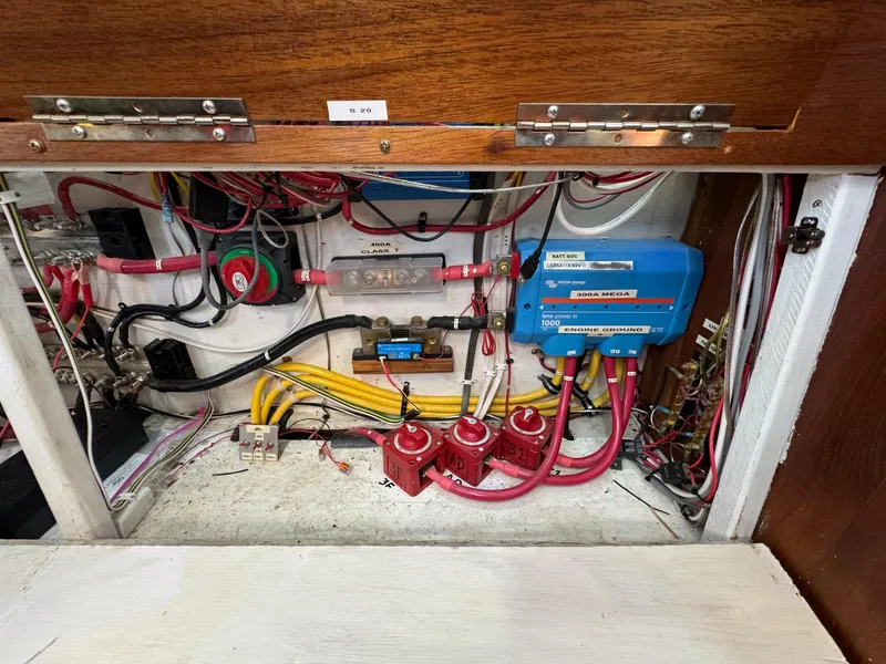 Slide: The Image of Electrical panel of a 1983 Islander Freeport boat with wiring and components. - 30