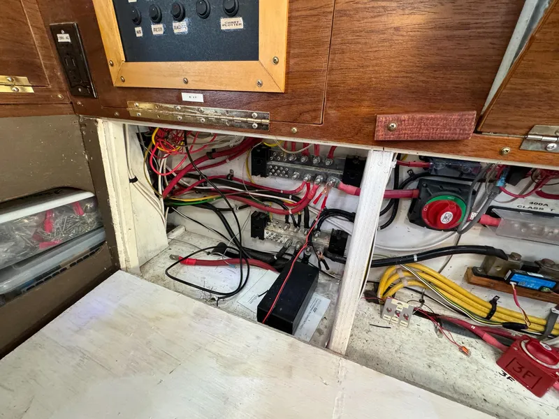 Slide: The Image of Electrical panel and wiring inside a 1983 Islander Freeport boat. - 31