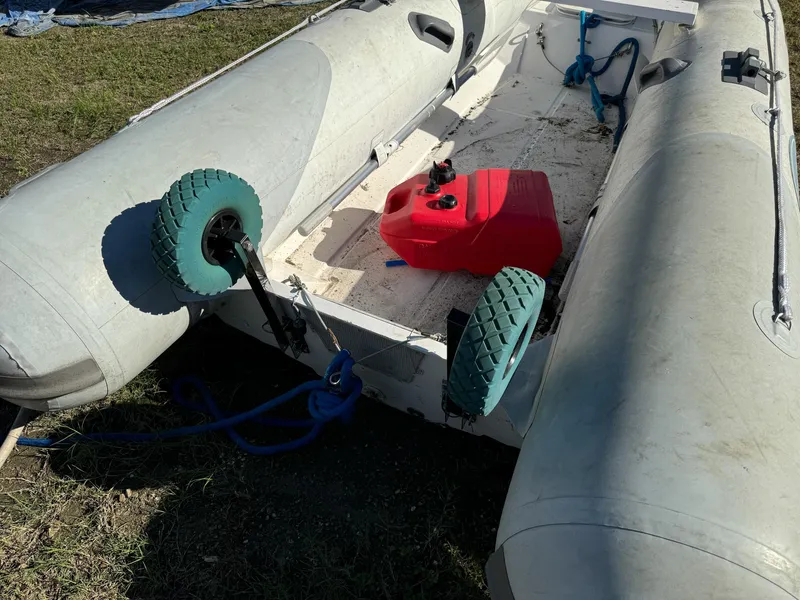 Slide: The Image of Inflatable boat with wheels and red fuel tank, Islander Freeport 1983 model. - 41