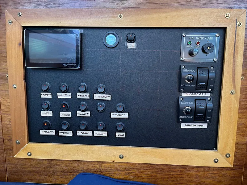 Slide: The Image of Control panel of a 1983 Islander Freeport boat with switches and gauges. - 8