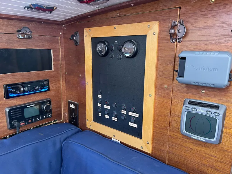 Slide: The Image of 1983 Islander Freeport sailboat interior with navigation and control panel. - 9