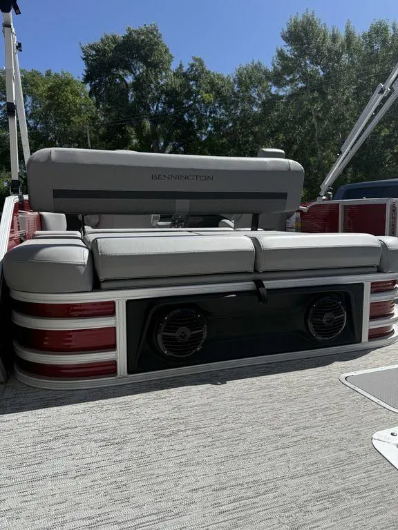 Slide: The Image of 2025 Bennington 22 MSB pontoon boat with plush seating and built-in speakers. - 11