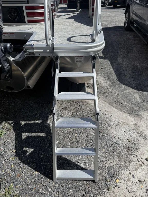 Slide: The Image of Rear view of 2025 Bennington 22 MSB boat with extended boarding ladder. - 5