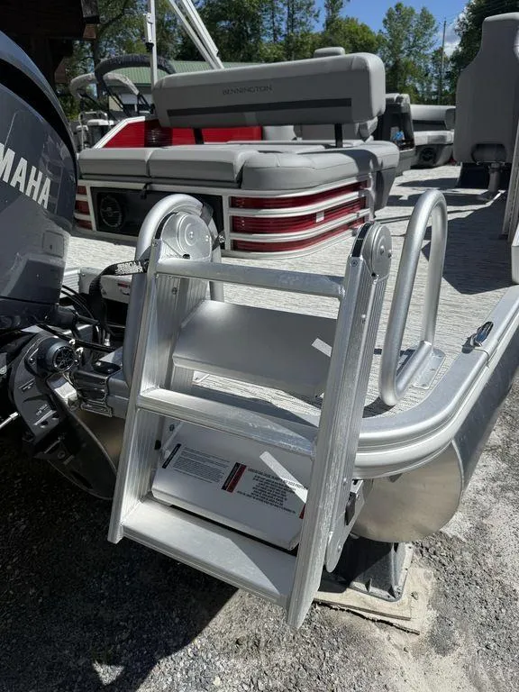 Slide: The Image of 2025 Bennington 22 MSB pontoon boat with Yamaha engine and boarding ladder. - 6