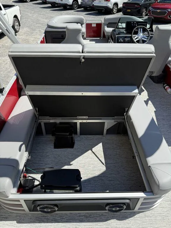 Slide: The Image of 2025 Bennington 22 MSB boat interior with open storage compartment and seating. - 8