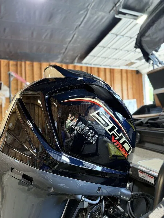 Slide: The Image of Yamaha SHO VMAX engine on a 2025 Bennington 24 MSB boat in a garage. - 11