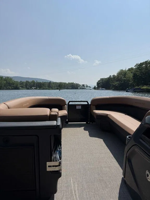 Slide: The Image of 2025 Bennington 24 MSB pontoon boat interior with lake view and clear sky. - 12