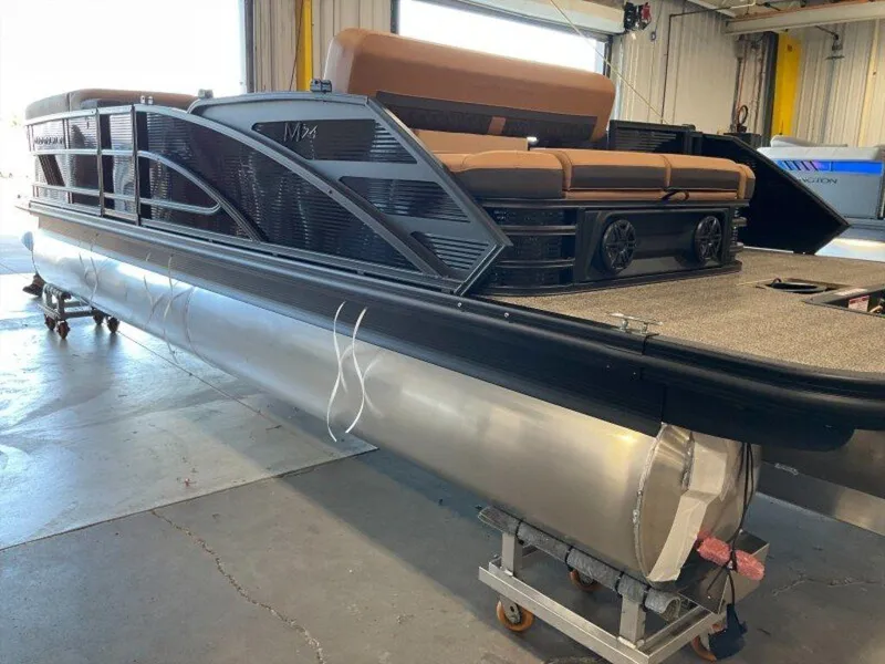 Slide: The Image of 2025 Bennington 24 MSB pontoon boat in a workshop setting. - 25