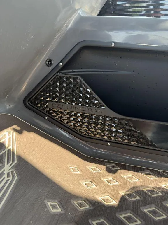 Slide: The Image of 2025 Bennington 24 MSB boat interior with textured panel and geometric floor design. - 7