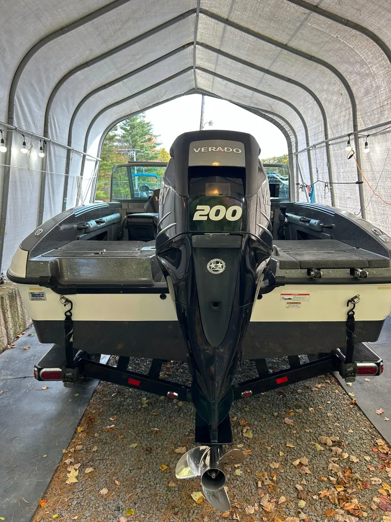 Slide: The Image of 2018 Lund 189 Tyee GL boat with 200 HP Verado engine in covered storage. - 11