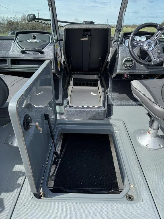 Slide: The Image of 2018 Lund 189 Tyee GL boat interior with open storage compartments. - 7