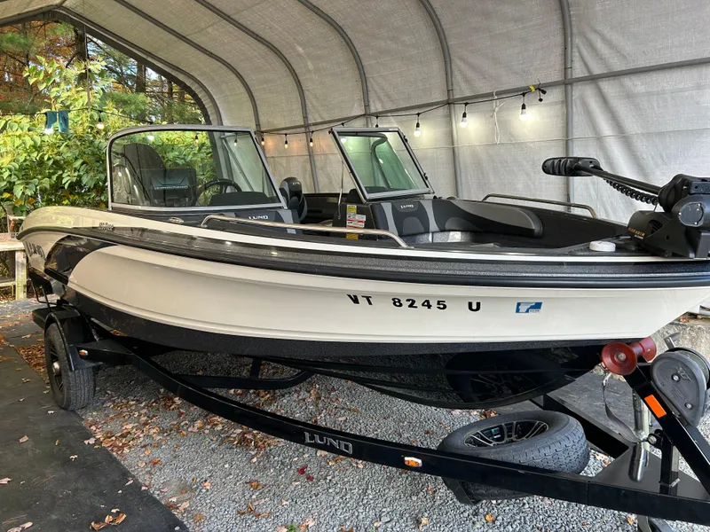 Slide: The Image of 2018 Lund 189 Tyee GL boat on trailer in covered storage. - 8