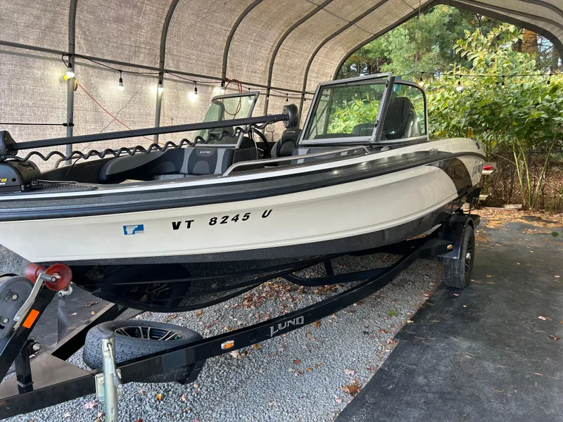 Slide: The Image of 2018 Lund 189 Tyee GL boat on trailer under canopy. - 9