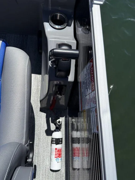 Slide: The Image of Interior of a 2025 Bennington 25LSR boat showing controls and safety equipment. - 11