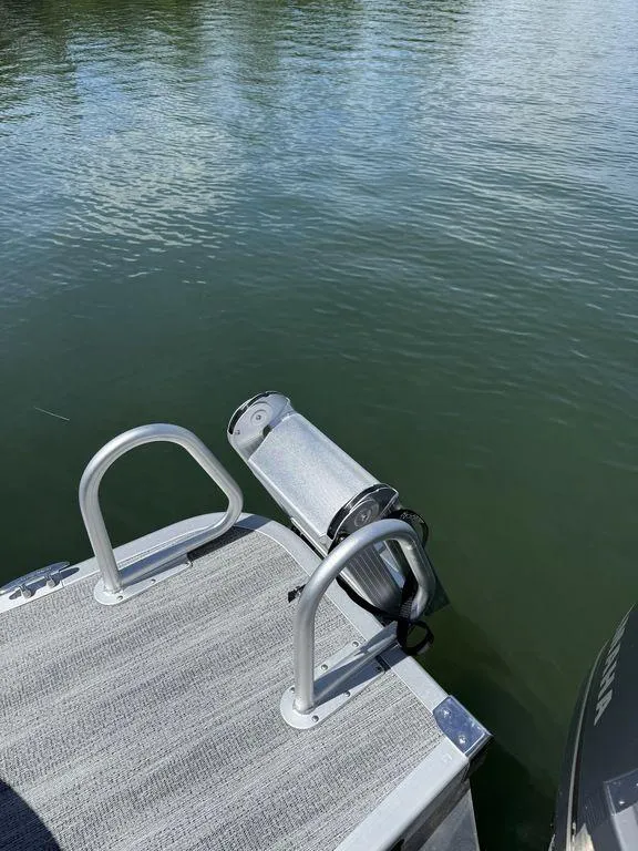 Slide: The Image of Bennington 25LSR 2025 boat deck with ladder and water view. - 7