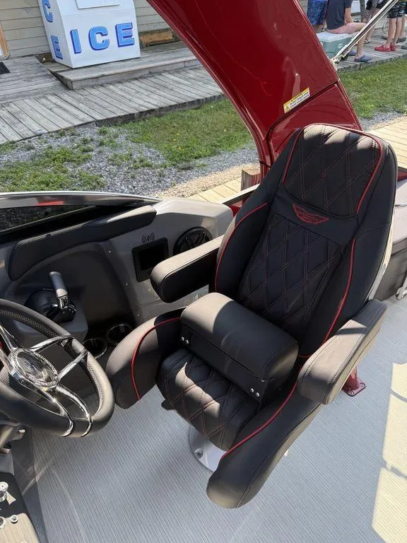 Slide: The Image of Luxurious captain's chair in 2025 Bennington 25RSBWAX1 boat, featuring sleek design and premium materials. - 14