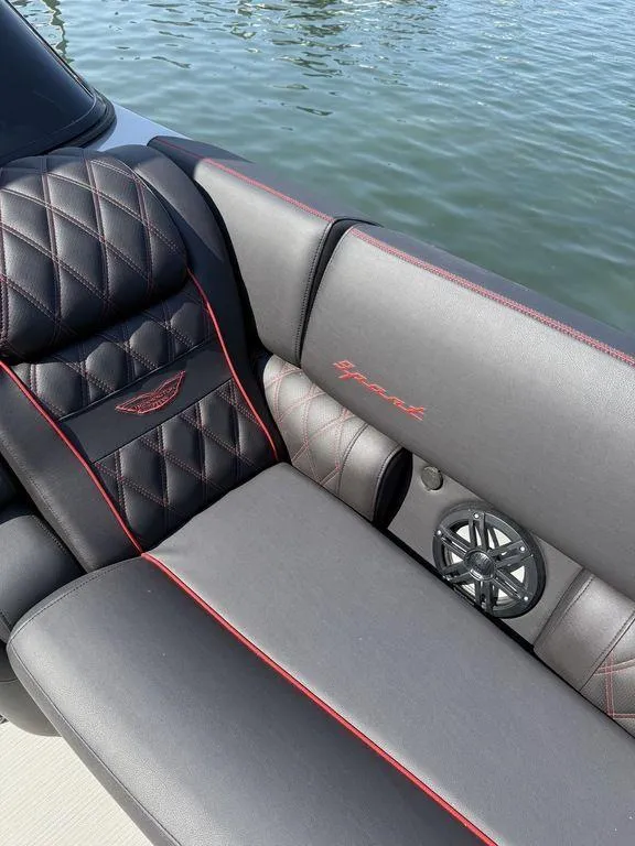 Slide: The Image of Luxurious seating on 2025 Bennington 25RSBWAX1 boat with diamond stitching and red accents. - 20
