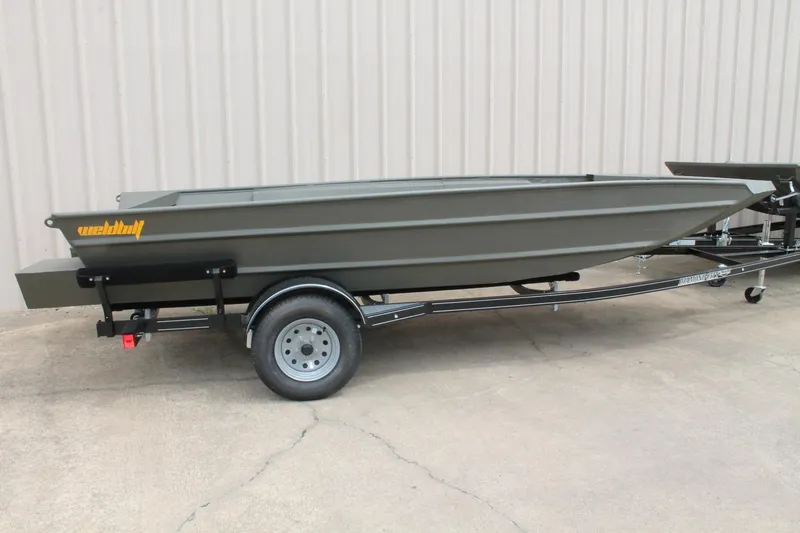 Slide: The Image of 2024 WeldBilt 1756V boat on trailer, parked outdoors. - 3