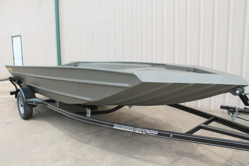 Slide: The Image of 2024 WeldBilt 1756V boat on trailer, parked outdoors. - 4