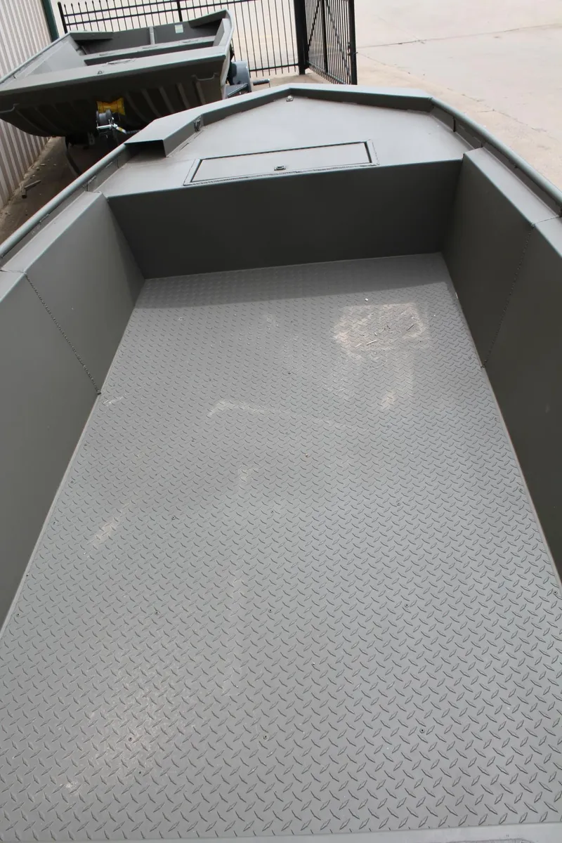 Slide: The Image of 2024 WeldBilt 1756V boat interior with textured flooring, gray finish. - 6