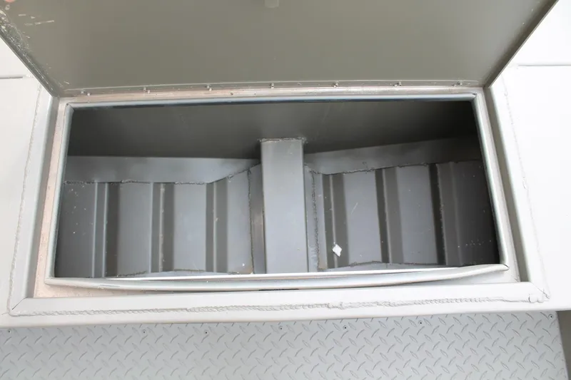 Slide: The Image of Open storage compartment in 2024 WeldBilt 1756V boat. - 8