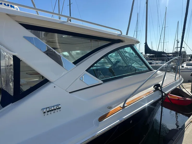 Slide: The Image of 2016 Tiara Yachts 3100 Coronet docked at marina, side view. - 4