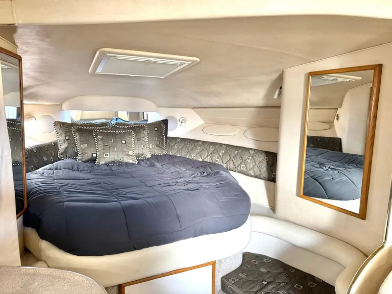 Slide: The Image of Luxurious cabin interior of 2000 Sea Ray 340 Sundancer yacht with cozy bedding. - 14