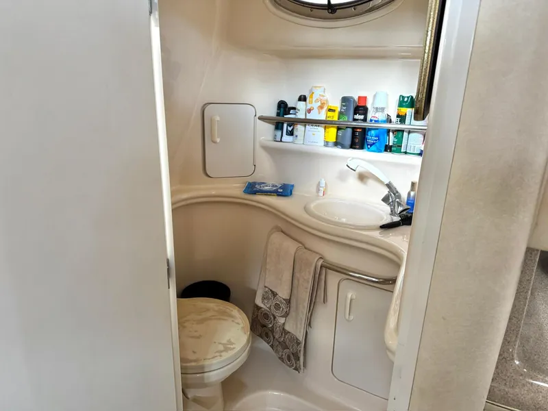 Slide: The Image of Bathroom of 2000 Sea Ray 340 Sundancer yacht with toiletries and towels. - 18