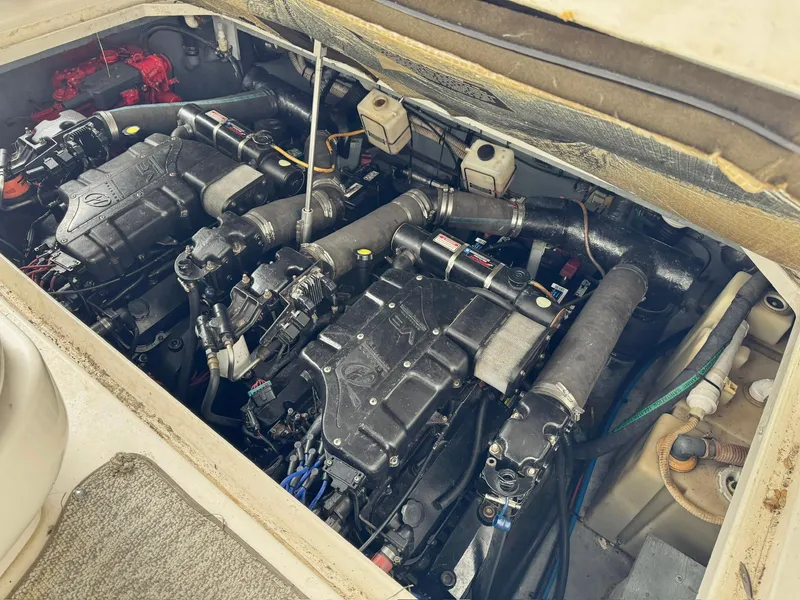 Slide: The Image of Engine compartment of 2000 Sea Ray 340 Sundancer boat, showcasing dual engines. - 20