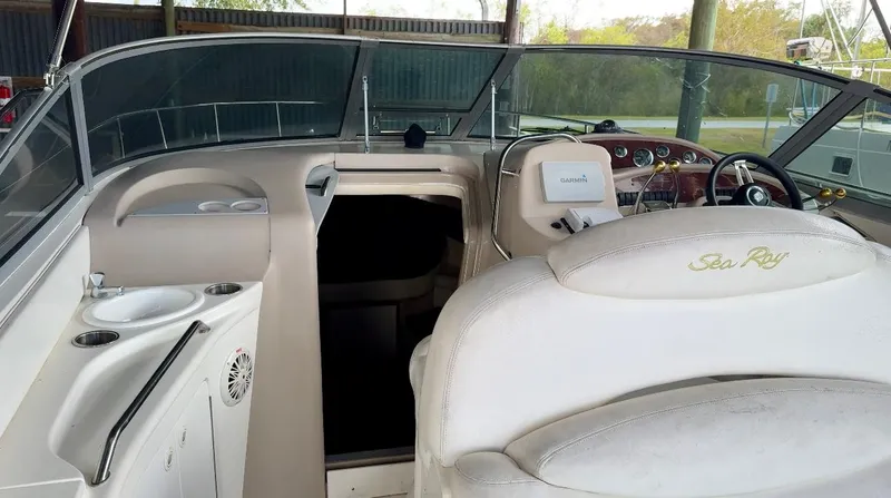 Slide: The Image of 2000 Sea Ray 340 Sundancer cockpit with helm and seating area. - 23
