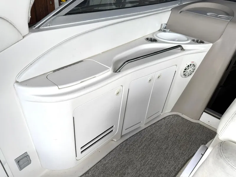 Slide: The Image of Interior of 2000 Sea Ray 340 Sundancer boat with white cabinetry and sink. - 25