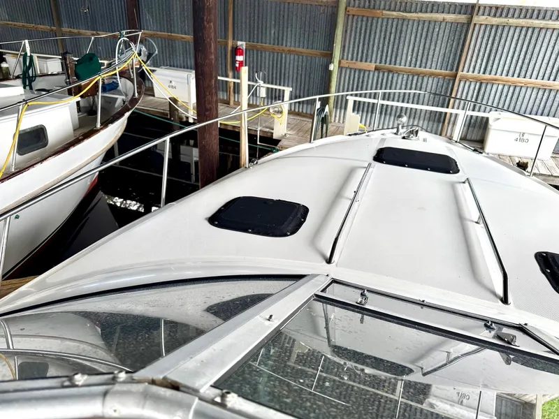 Slide: The Image of 2000 Sea Ray 340 Sundancer docked in a marina, top deck view. - 5