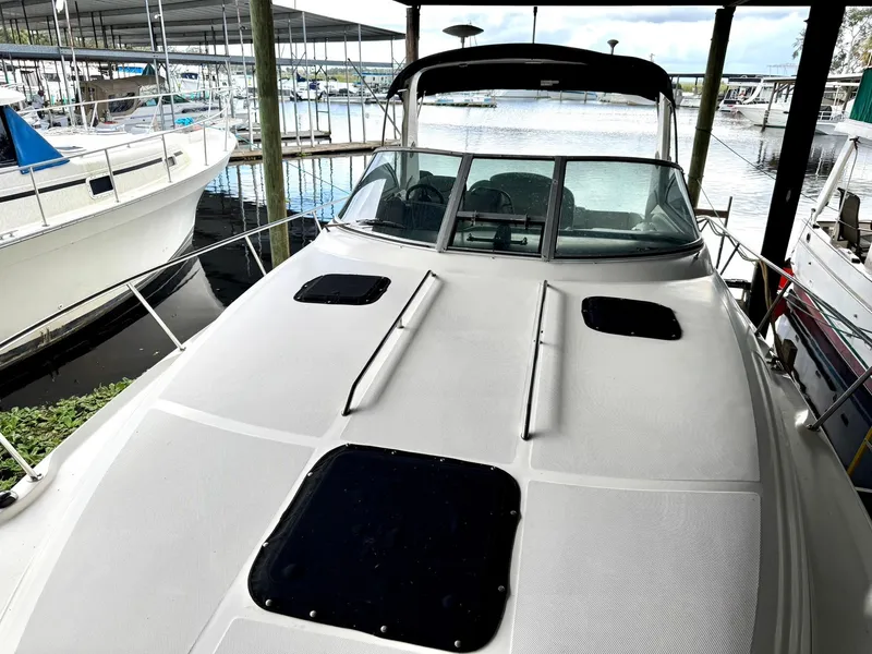 Slide: The Image of 2000 Sea Ray 340 Sundancer docked at marina, front deck view. - 8