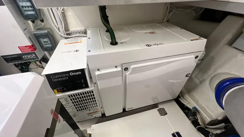 Slide: The Image of Cummins Onan generator in 2021 Maritimo X60 yacht engine room. - 23