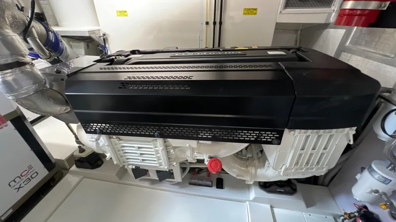 Slide: The Image of Engine room of 2021 Maritimo X60 yacht, showcasing advanced machinery and components. - 27