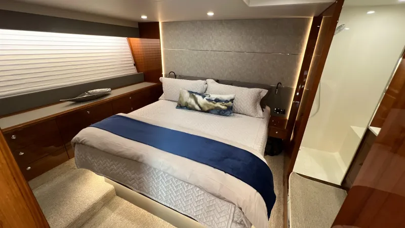 Slide: The Image of Luxurious bedroom interior of 2021 Maritimo X60 yacht with elegant bedding and modern design. - 30