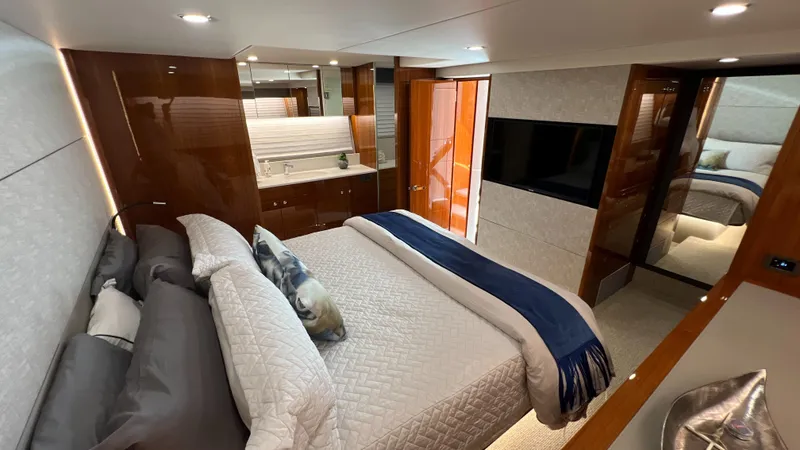 Slide: The Image of Luxurious bedroom interior of 2021 Maritimo X60 yacht with modern design and elegant furnishings. - 32