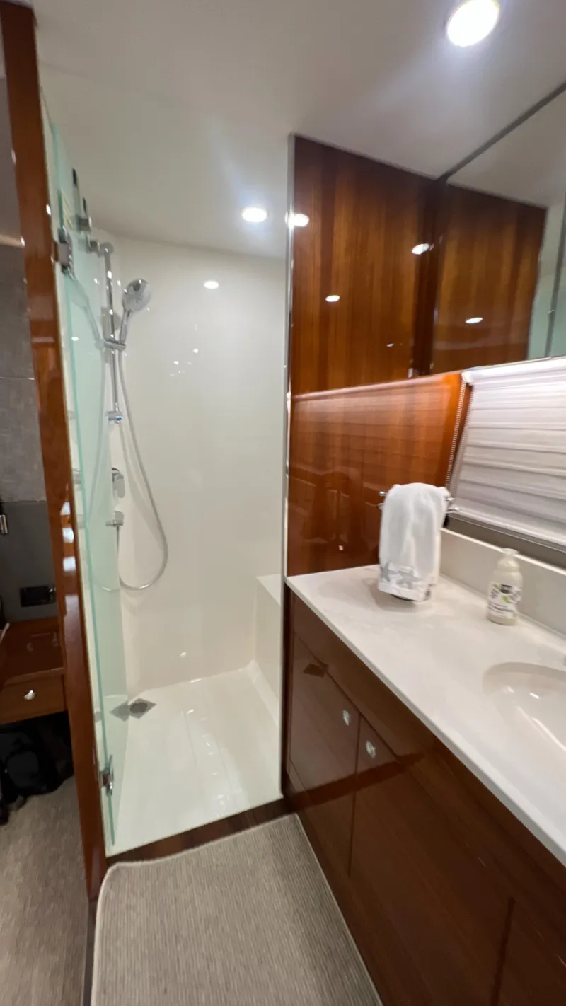 Slide: The Image of Luxurious bathroom in 2021 Maritimo X60 yacht with modern shower and sleek wood finishes. - 34