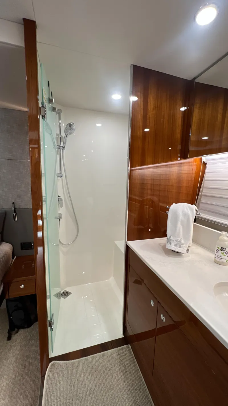 Slide: The Image of Luxurious bathroom in 2021 Maritimo X60 yacht with modern shower and elegant wood finishes. - 35