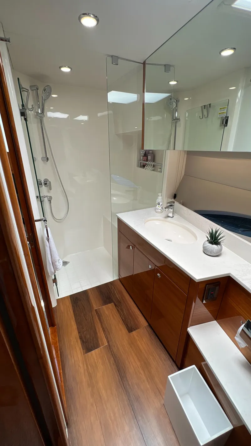 Slide: The Image of Luxurious bathroom in 2021 Maritimo X60 yacht with modern fixtures and wooden flooring. - 39