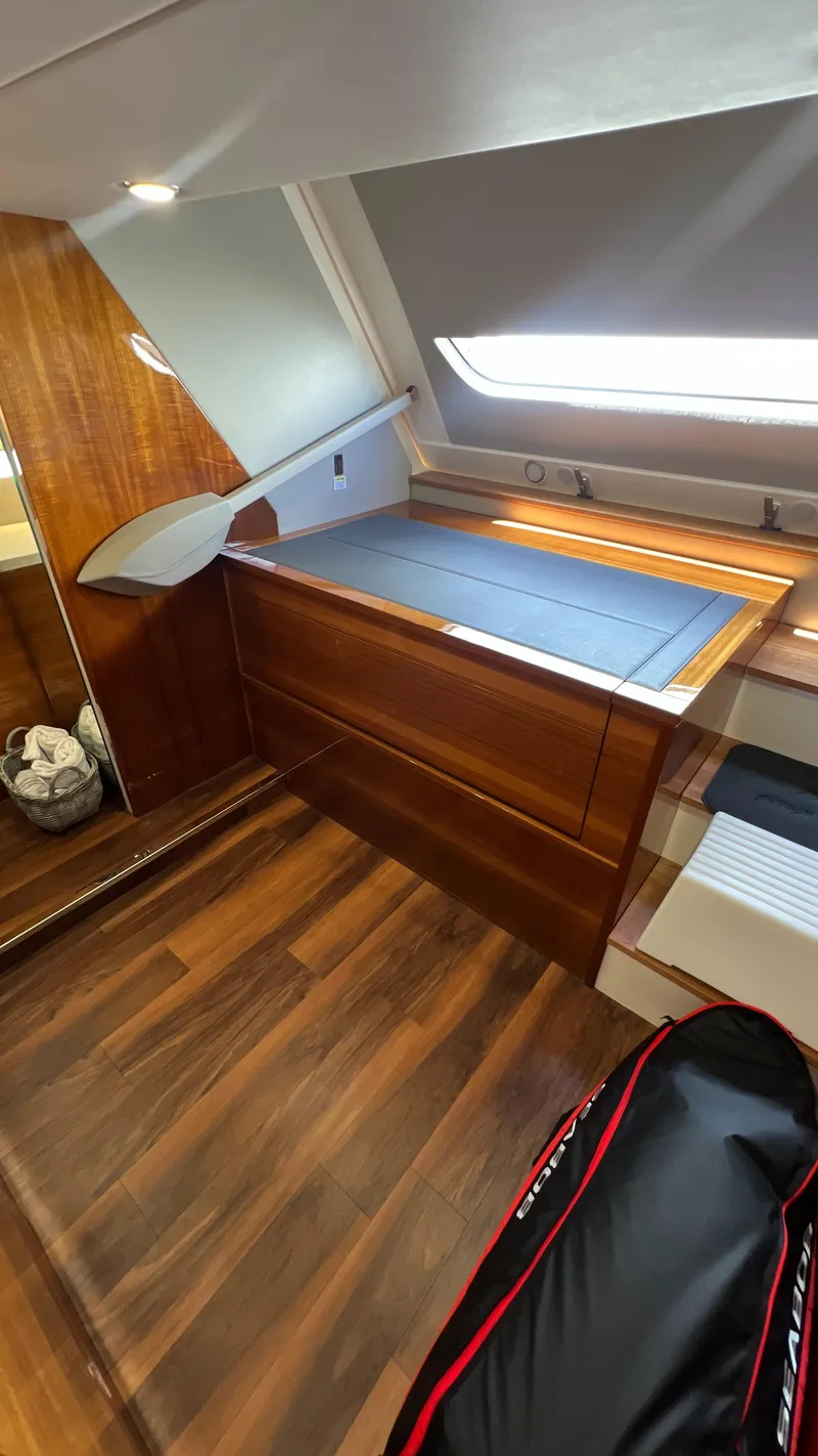 Slide: The Image of 2021 Maritimo X60 yacht interior with wooden flooring and sleek design. - 48