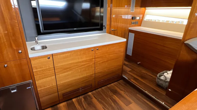Slide: The Image of Luxurious interior of 2021 Maritimo X60 yacht with wood cabinetry and modern amenities. - 49