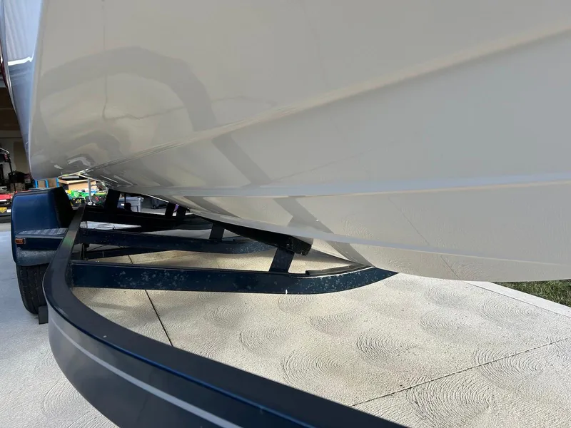 Slide: The Image of 2018 Four Winns HD220 boat hull on trailer, close-up view. - 20