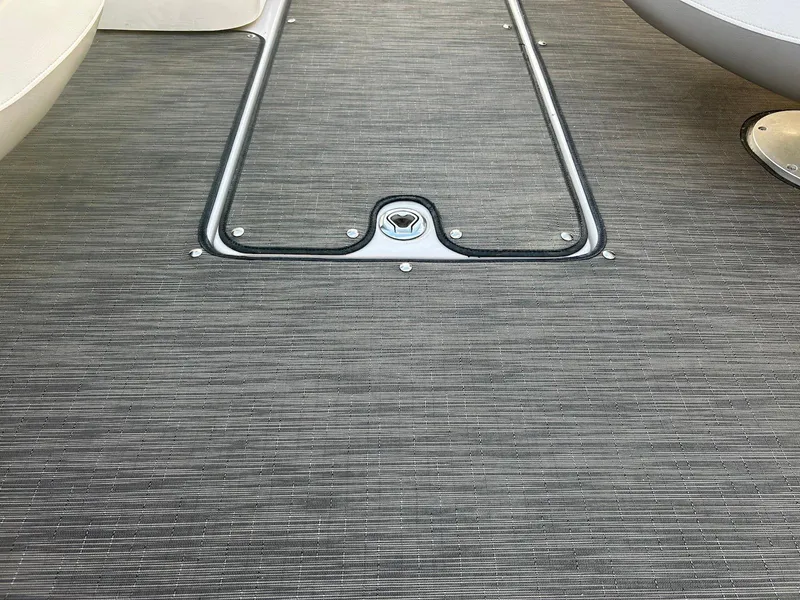 Slide: The Image of 2018 Four Winns HD220 boat deck with textured flooring and metal trim. - 26