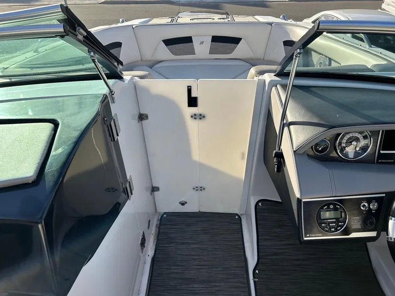 Slide: The Image of 2018 Four Winns HD220 boat interior with open cockpit and dashboard view. - 31