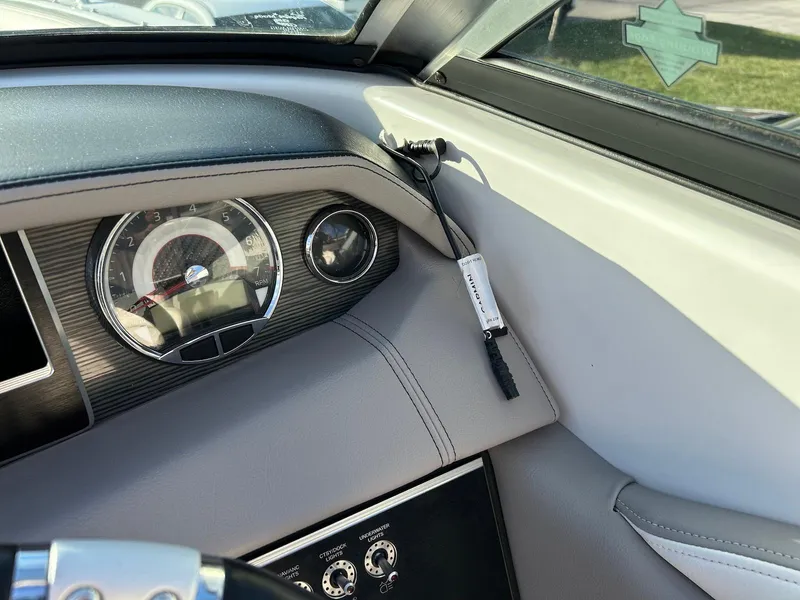 Slide: The Image of Dashboard of 2018 Four Winns HD220 boat with speedometer and controls. - 34