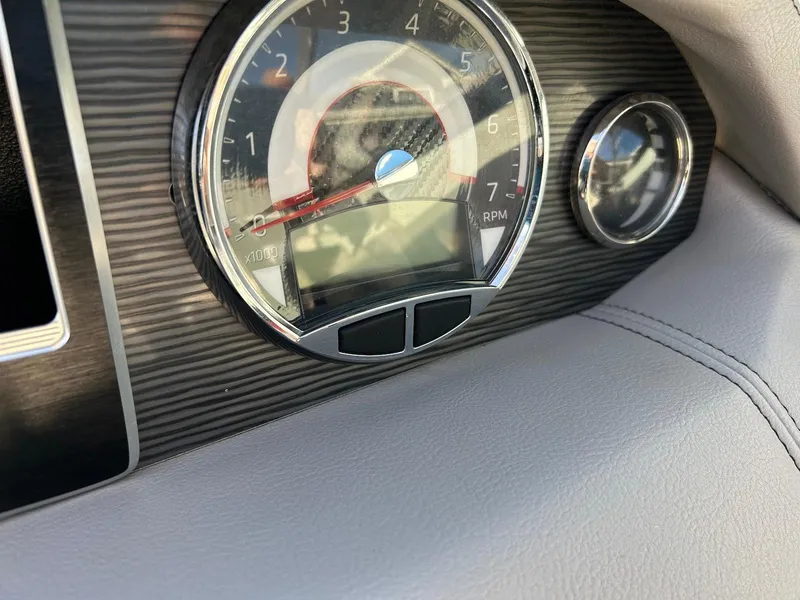 Slide: The Image of Dashboard of 2018 Four Winns HD220 boat with tachometer and sleek design. - 36