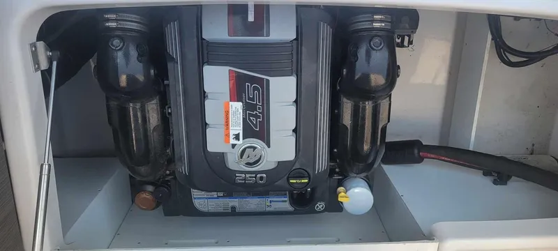 Slide: The Image of 2018 Four Winns HD220 engine compartment with 4.5L 250 horsepower engine. - 40