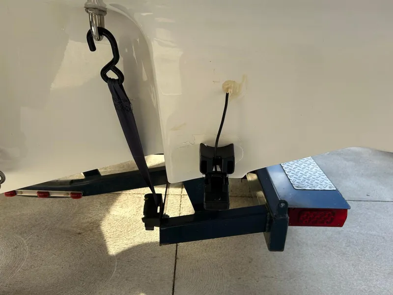 Slide: The Image of 2018 Four Winns HD220 boat trailer hitch and strap detail. - 43
