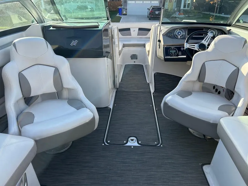 Slide: The Image of Interior of 2018 Four Winns HD220 boat with modern seating and dashboard. - 6